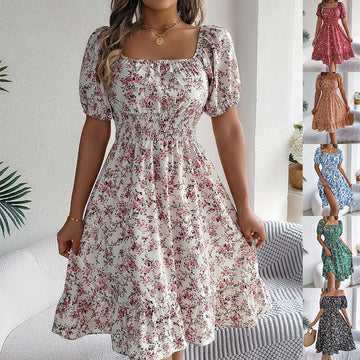 Woman wearing a floral dress with a neutral background
