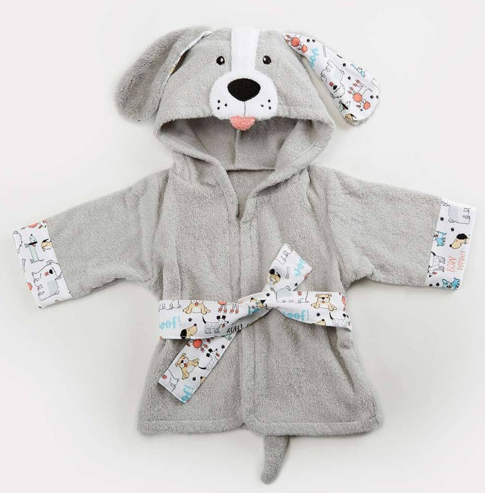 Baby wearing an elephant-themed hooded robe on a white bed.