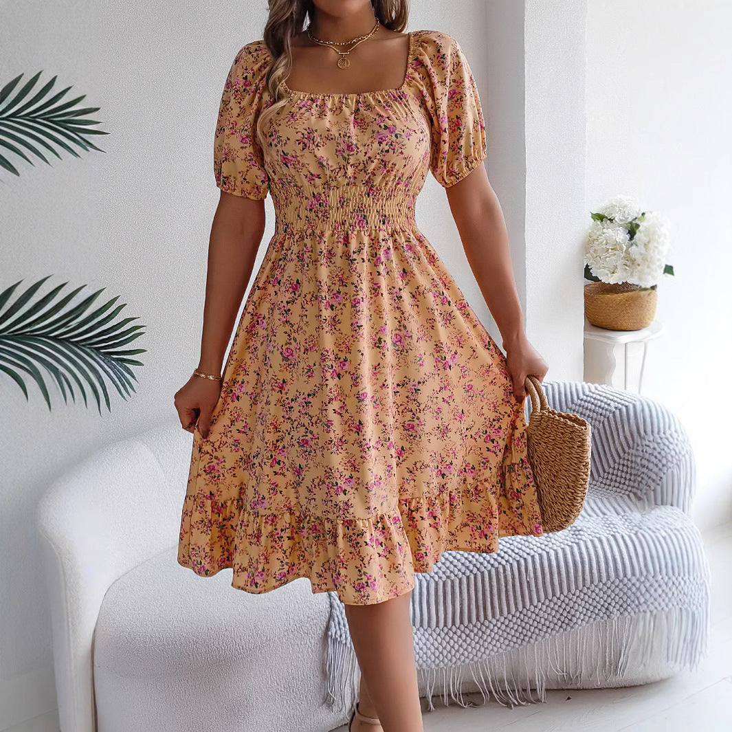 Woman wearing a floral dress with a neutral background